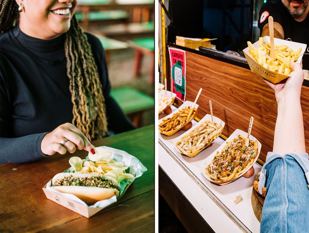 Mulher comendo cachorro-quente vegano e homem degustando batata frita no Rock the Mountain